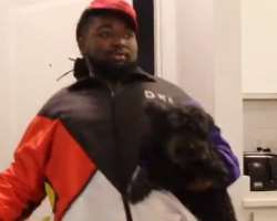 The star is accompanied by a small dog in his home.